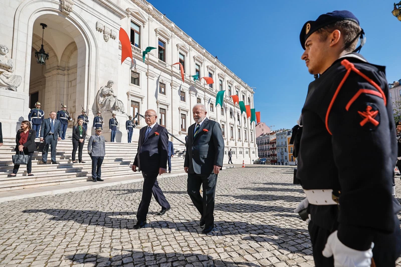 Luiz Inácio Lula da Silva, President of Brazil, walking outdoors in Portugal.