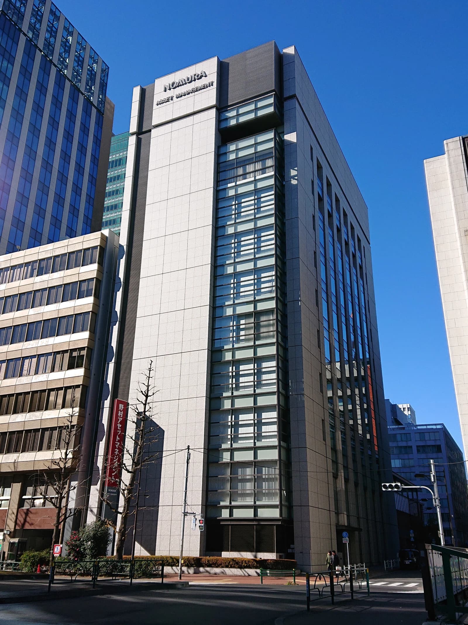 Exterior view of Nomura Asset Management headquarters building in Nihonbashi, Chuo, Tokyo.