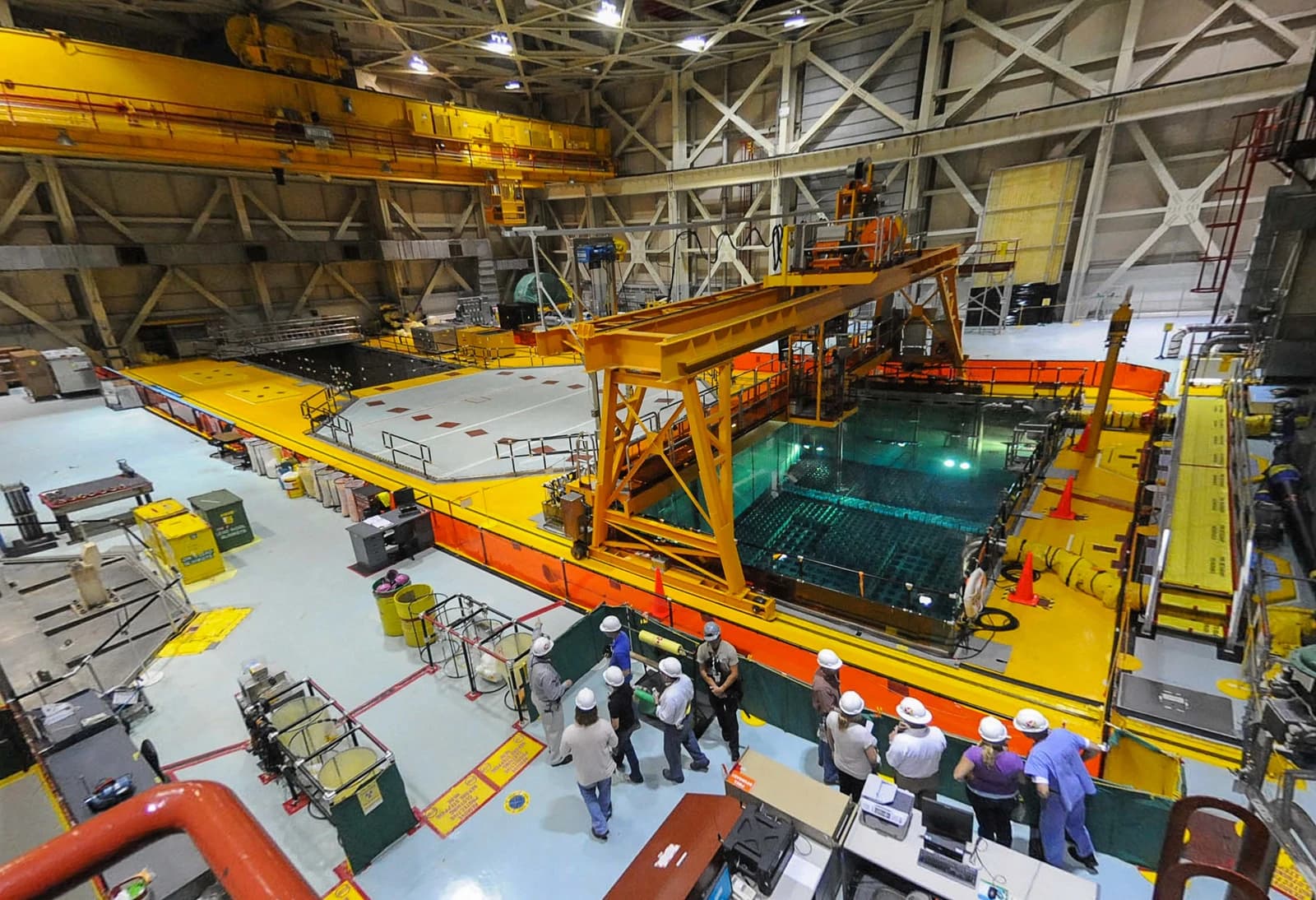 Workers in hard hats view the spent fuel pool at Brunswick Nuclear Power Plant.
