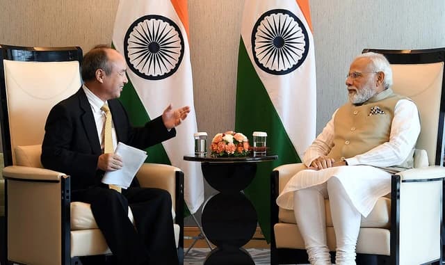 Masayoshi Son, CEO of SoftBank Group, speaks with Indian Prime Minister Narendra Modi.