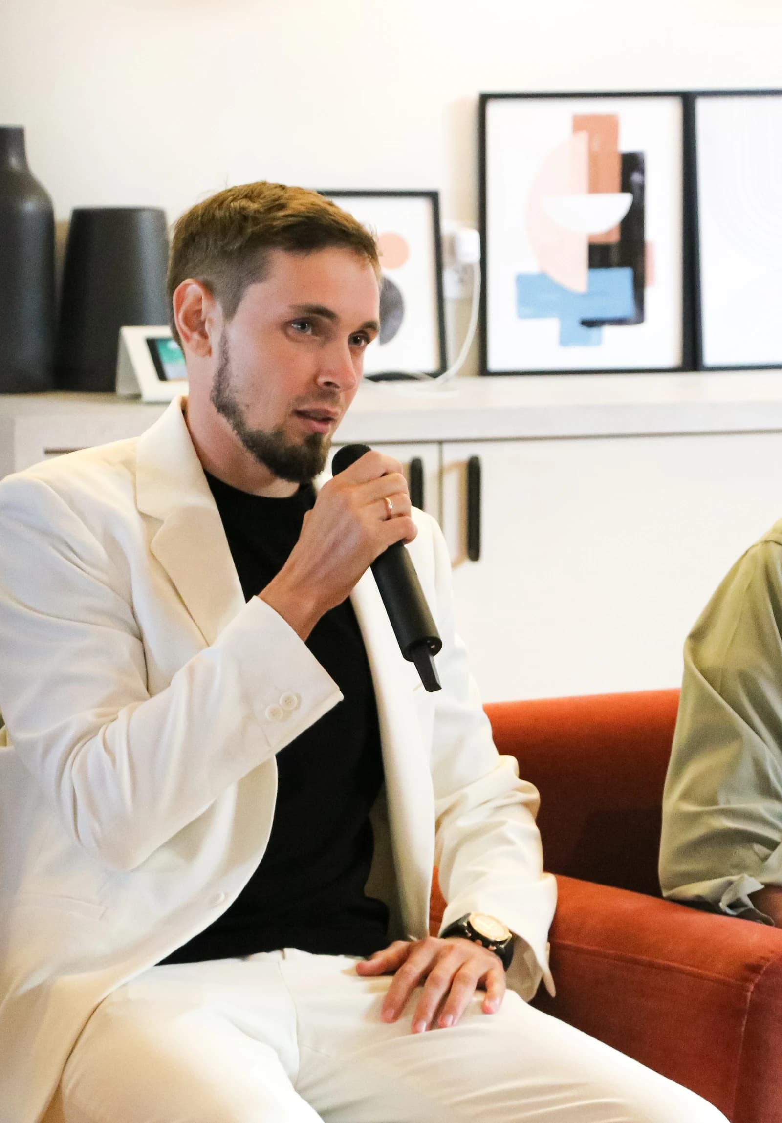 Yaroslav Ivanov, Co-Founder of ALTA-Blockchain Labs, speaks into a microphone at TechWeek 2023.
