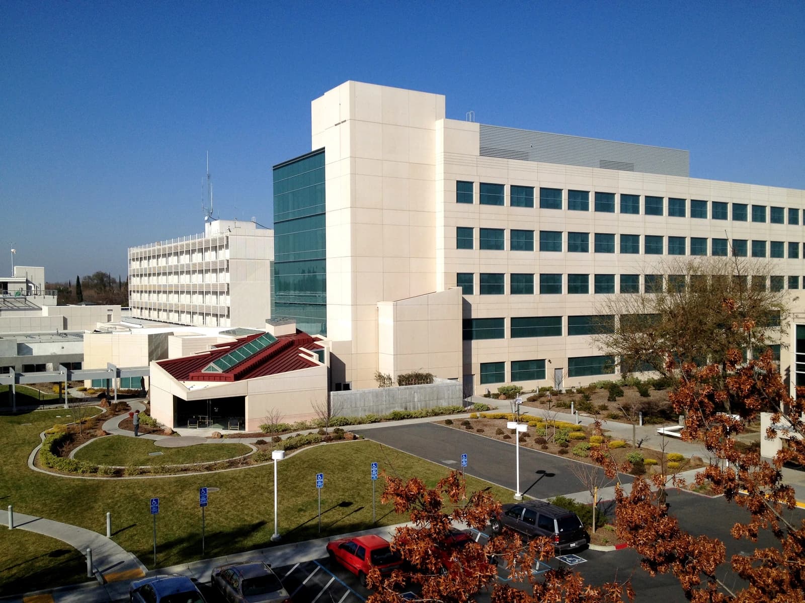 Exterior view of Mercy San Juan Medical Center, a large hospital building, under a clear blue sky.