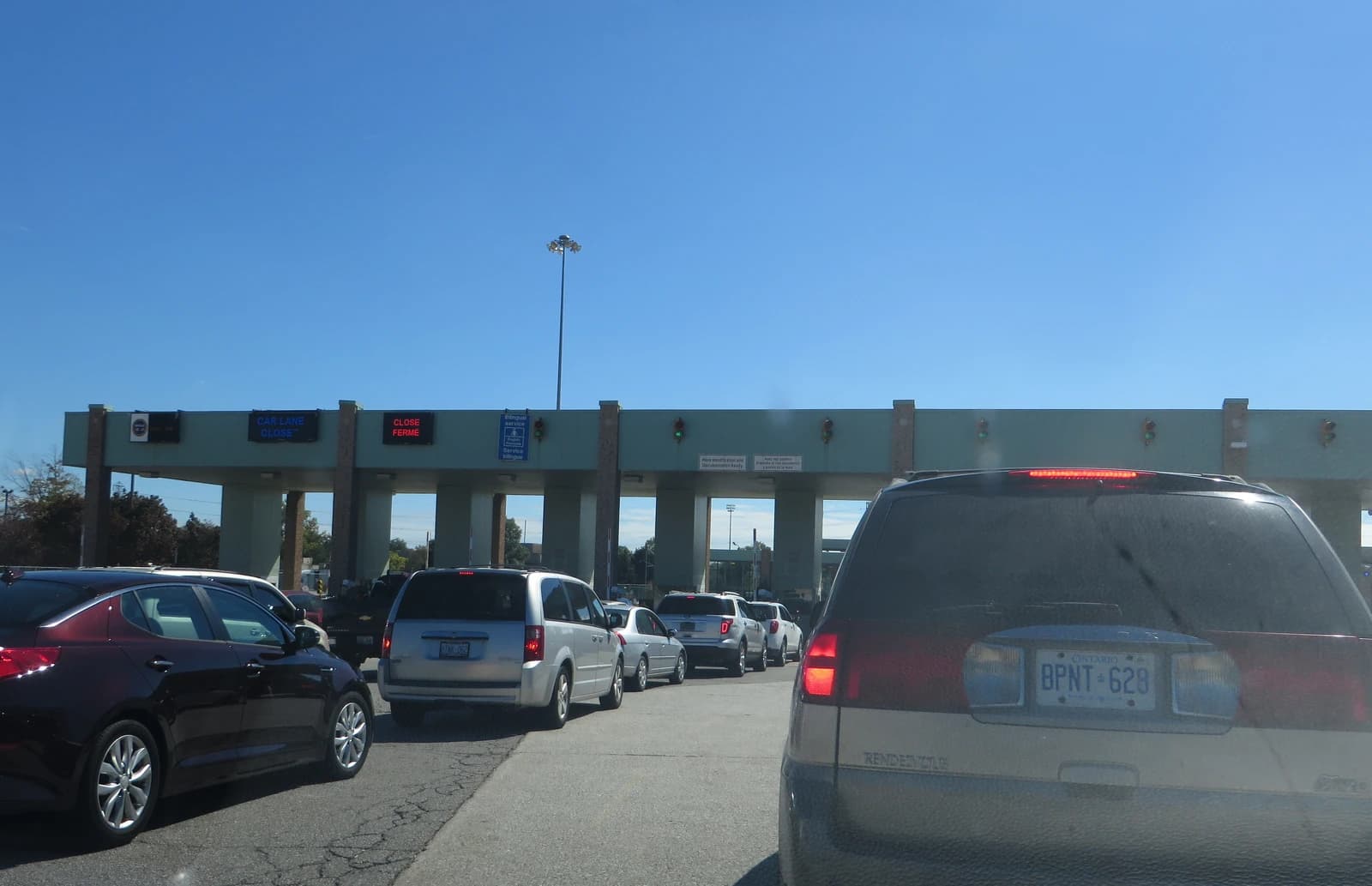 Cars waiting in line at Canadian Customs, Ambassador Bridge, Windsor, Ontario.