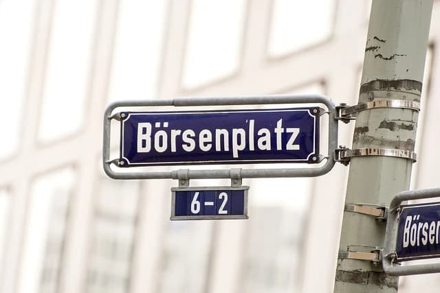 Street sign reading "Börsenplatz" in white text on a blue background.