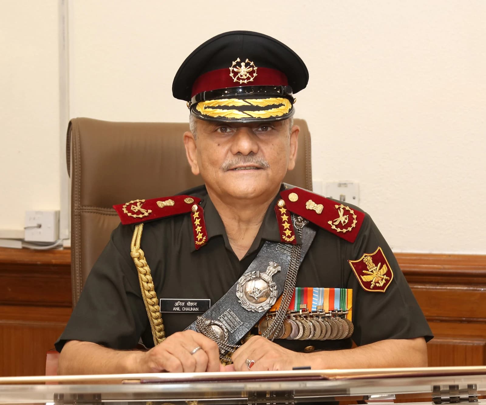 General Anil Chauhan, India's Chief of Defence Staff, seated at a desk.