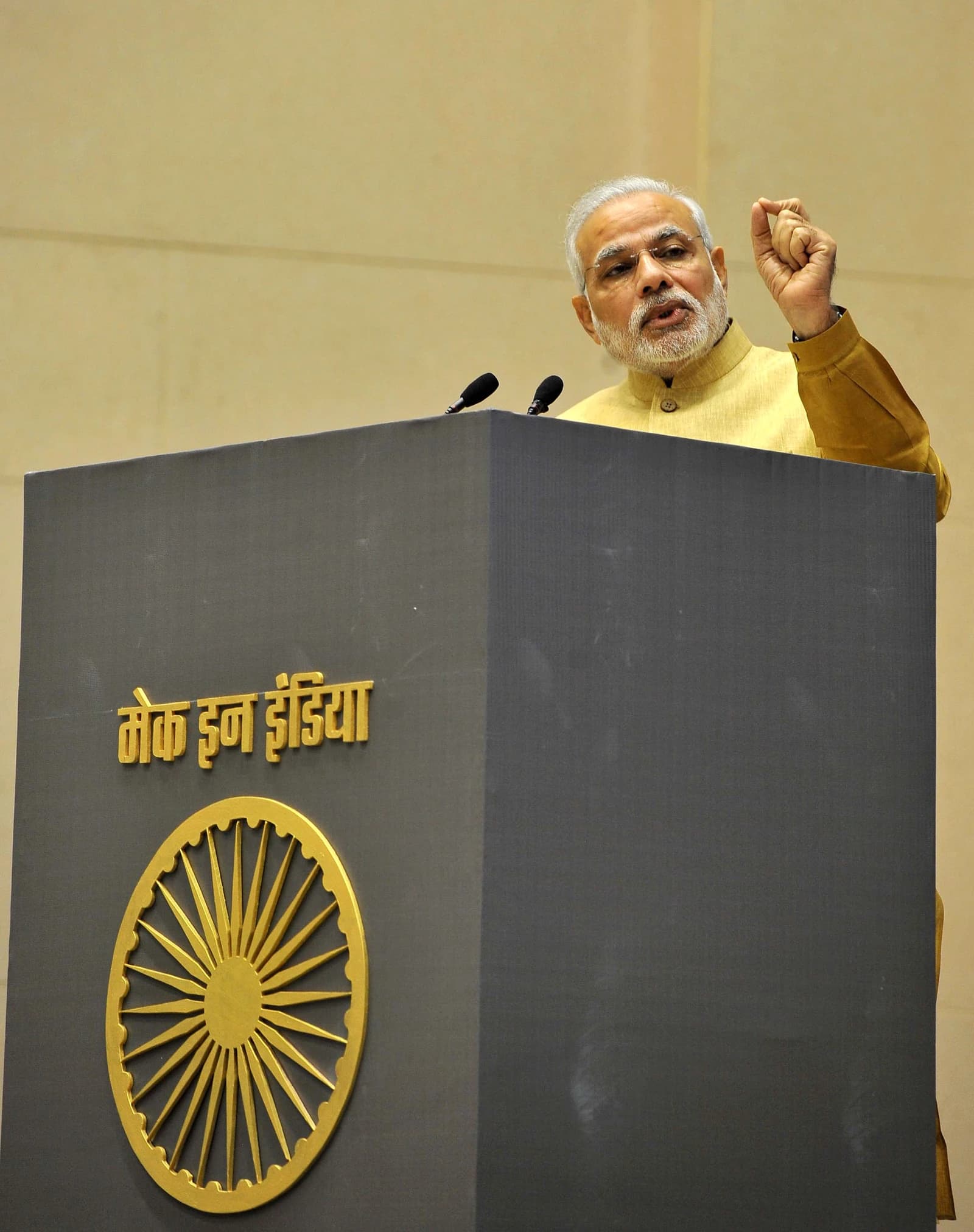 Prime Minister Narendra Modi speaks at a podium during the Make in India initiative launch.