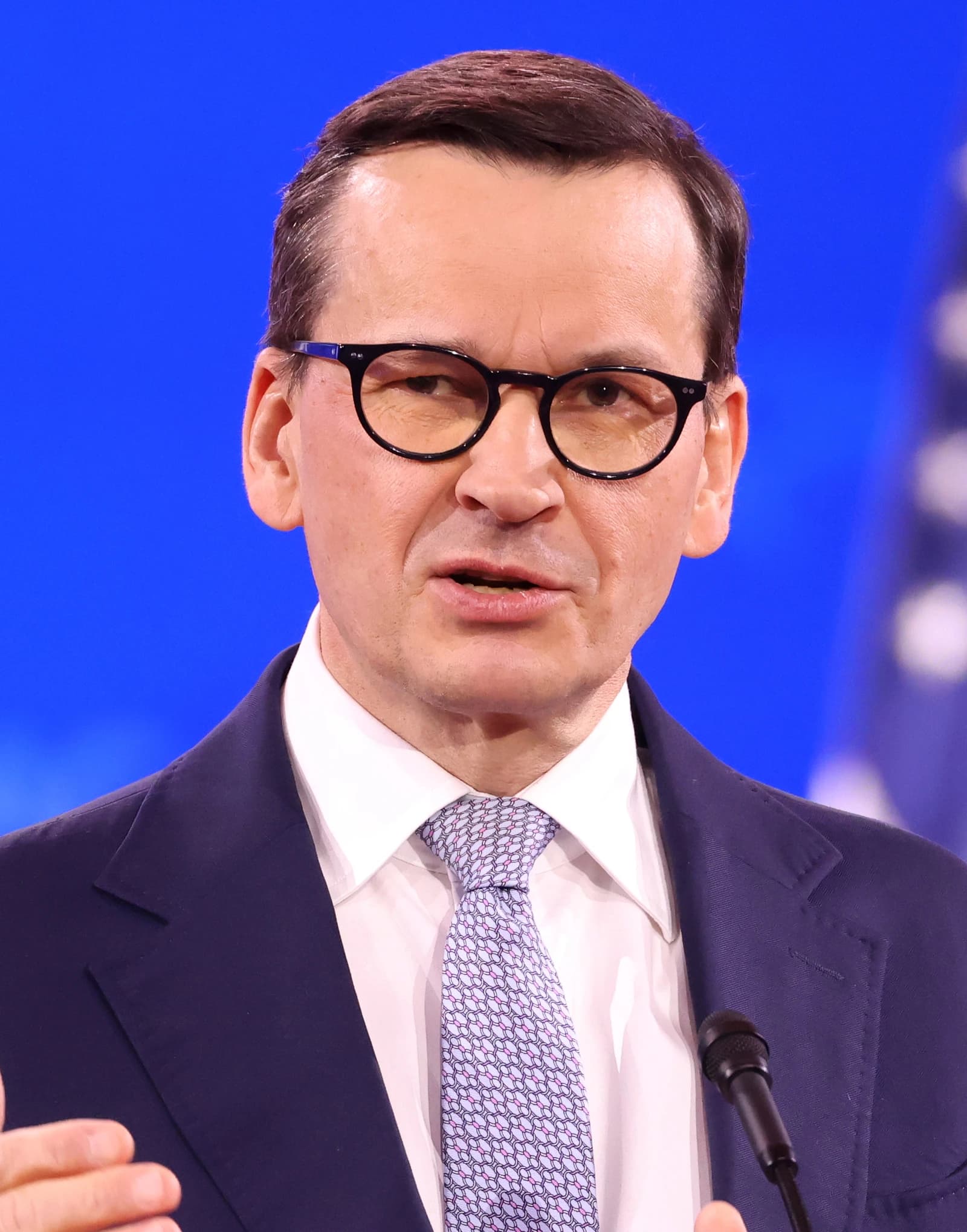 Mateusz Morawiecki, Prime Minister of Poland, speaking at a microphone.