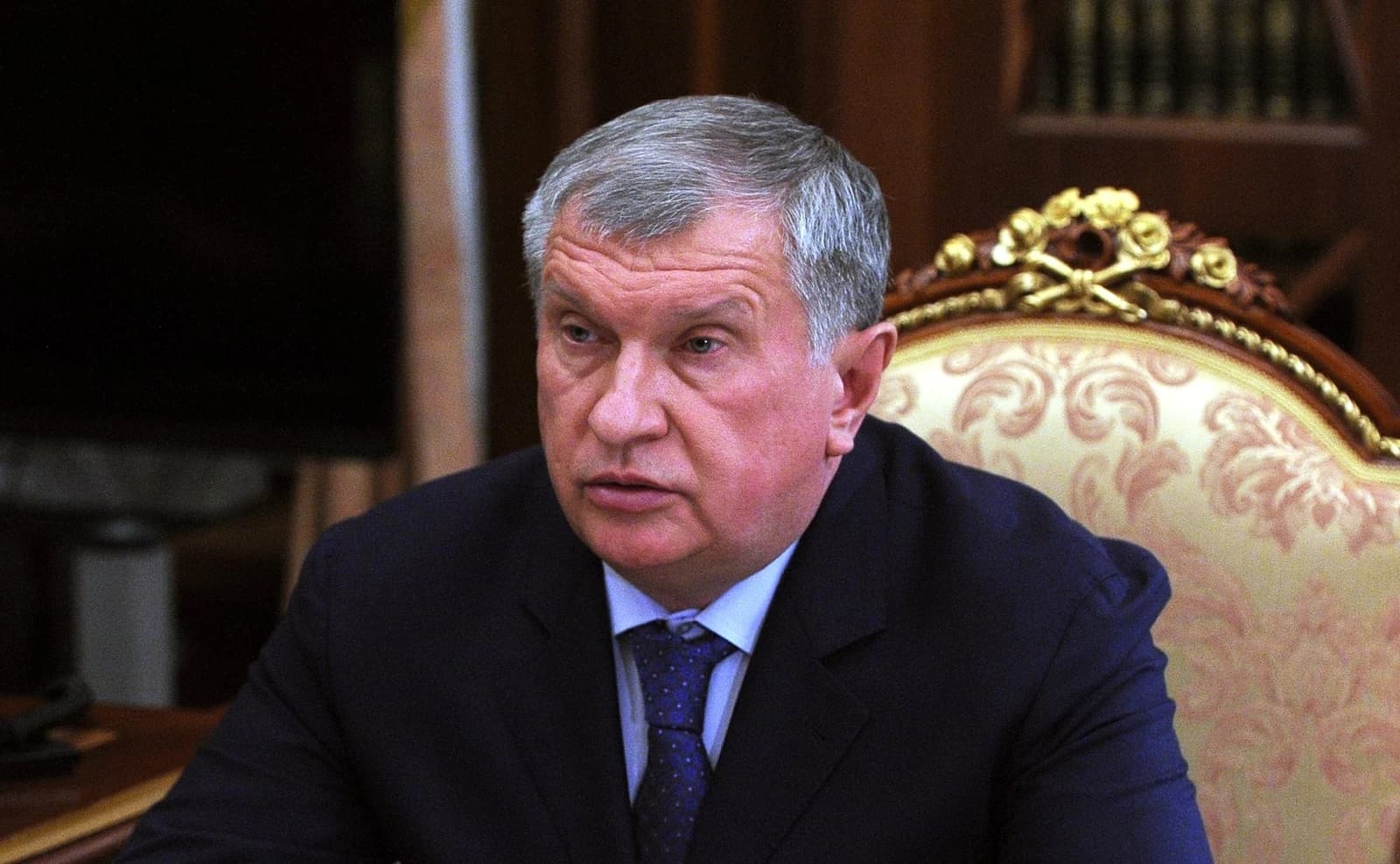 Igor Sechin, CEO of Rosneft, looks forward while seated indoors.
