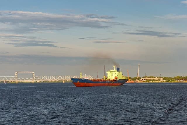 Oil tanker Varzuga sailing on Northern Dvina River near Arkhangelsk, Russia.