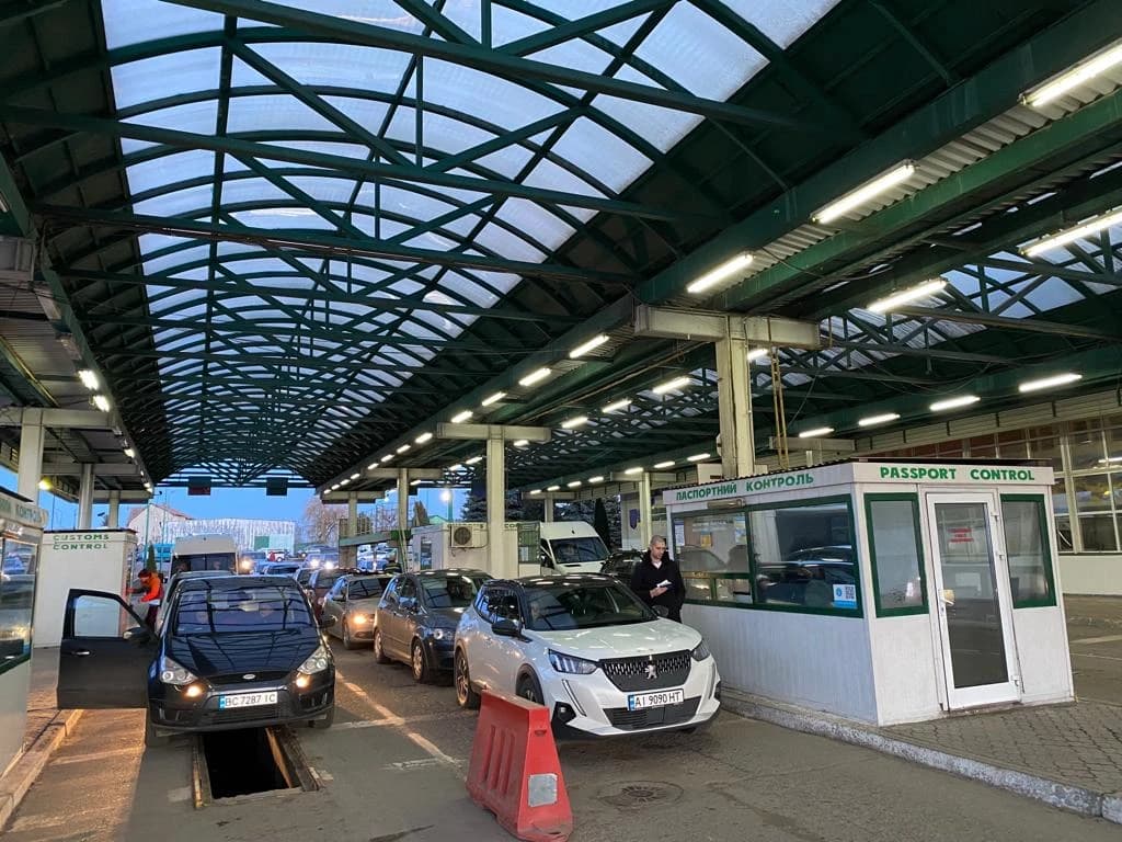 Vehicles waiting at passport control booths at a border crossing in western Ukraine.