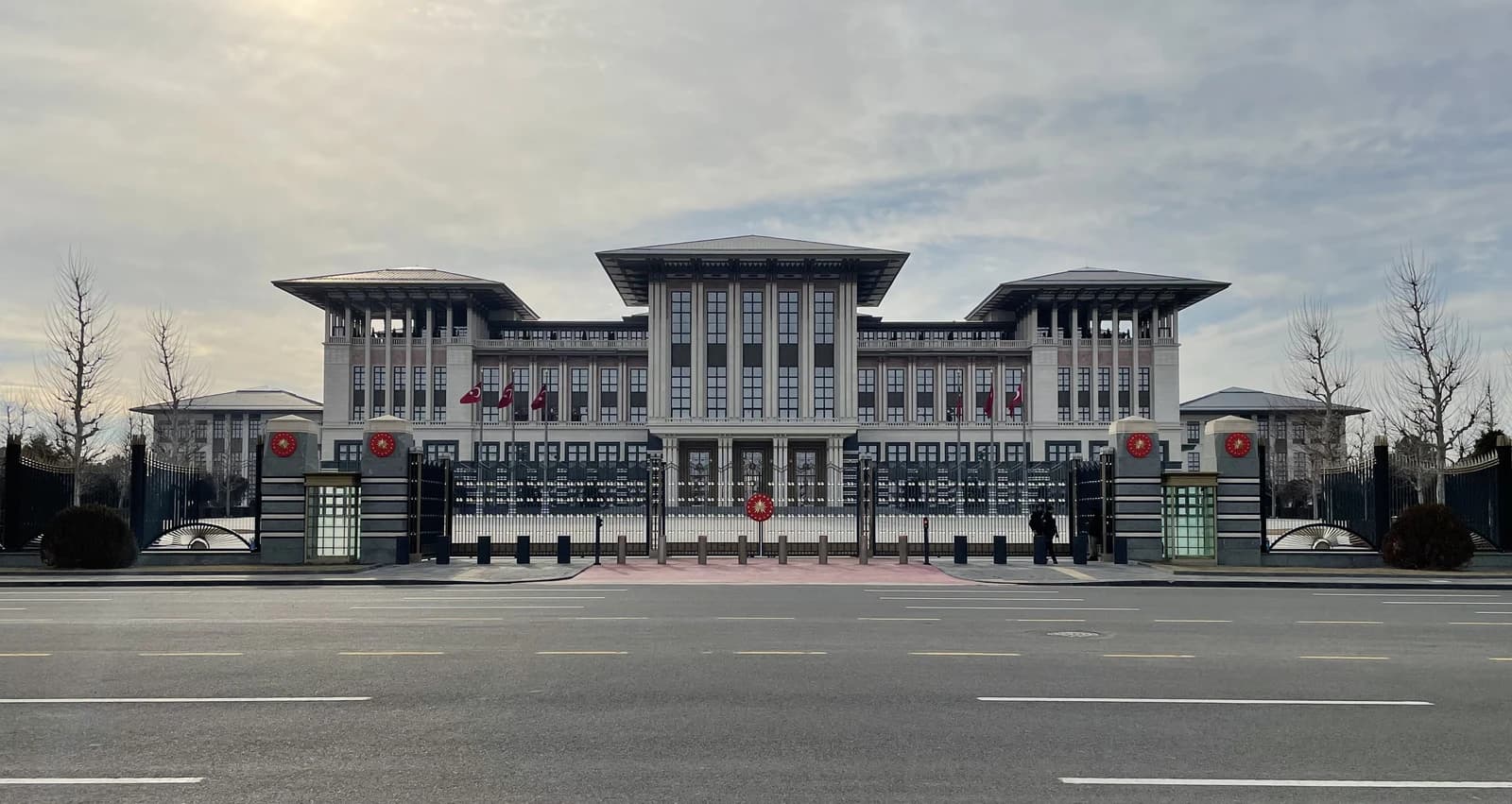 Exterior view of the Turkish Presidential Palace in Ankara, with a road in the foreground.
