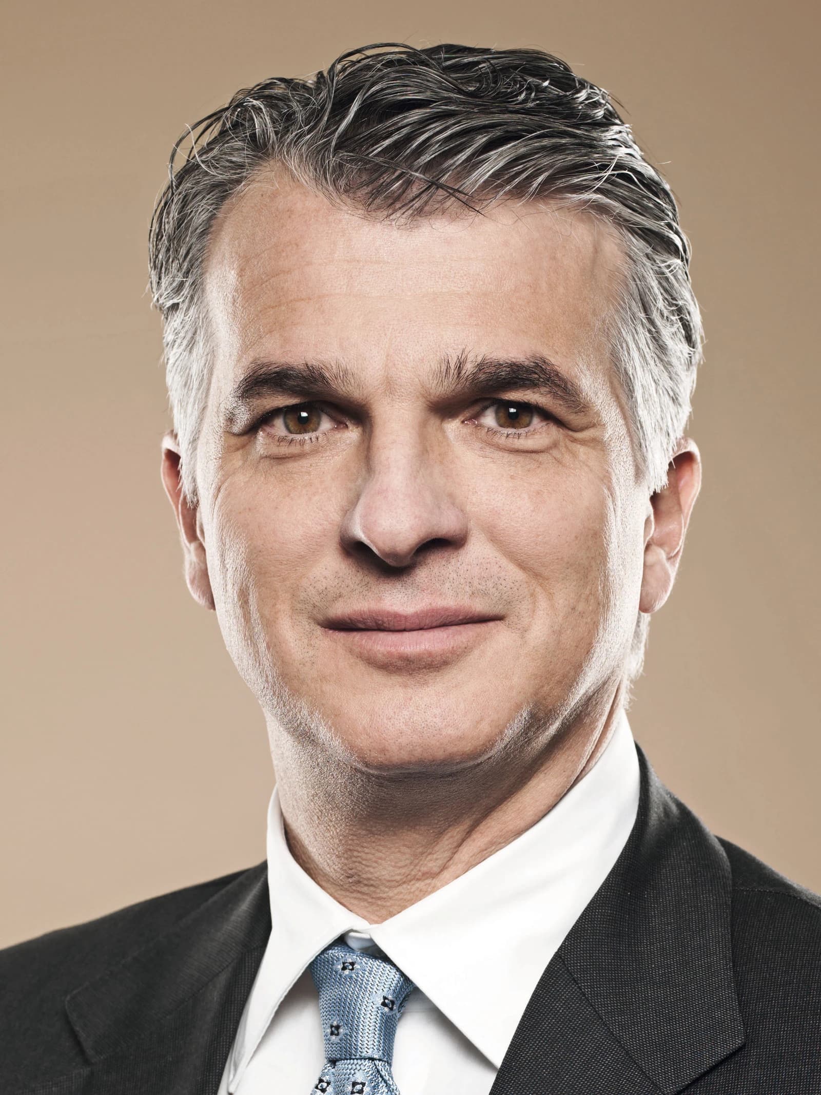 Sergio Ermotti, former CEO of UBS, looking at the viewer in a close-up portrait.