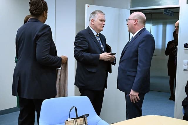 Members of a United States Congressional Delegation talking at IAEA headquarters in Vienna.