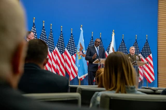 General Mark Milley and Secretary of Defense Lloyd Austin speaking at a press conference in Brussels.