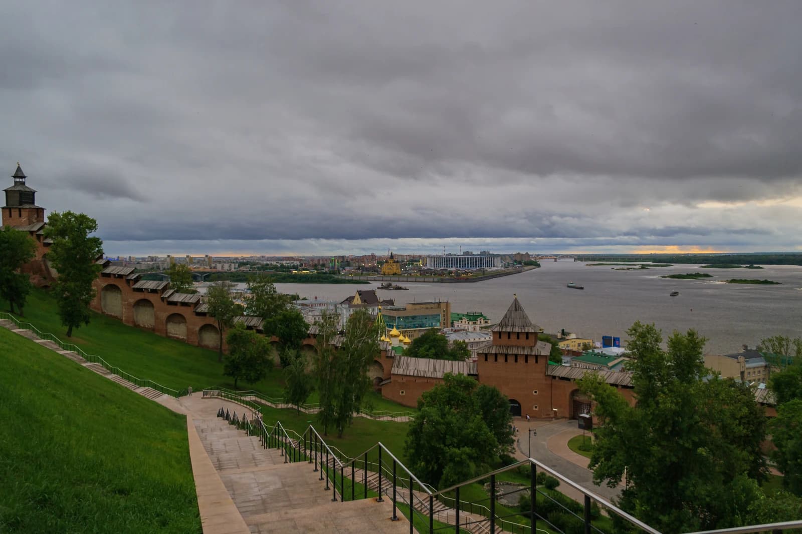 Overcast view of Nizhny Novgorod Kremlin, river confluence, and cityscape from an elevated perspective.