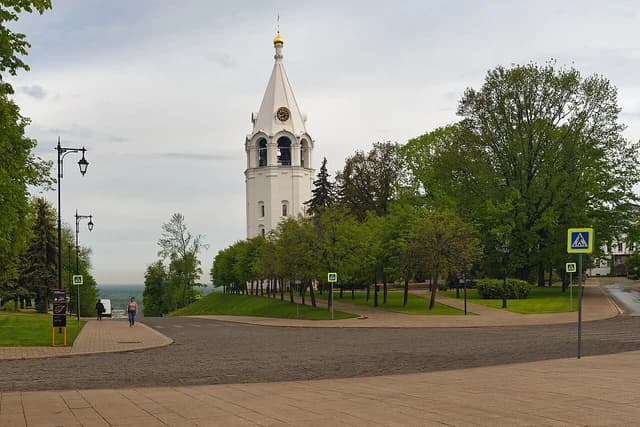 Restored bell tower of the Transfiguration Cathedral in Nizhny Novgorod Kremlin under cloudy sky.