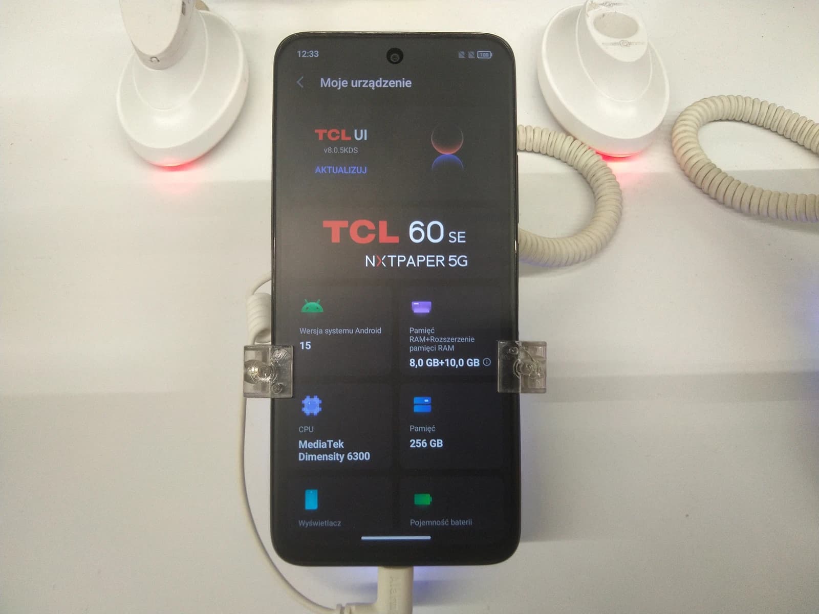 TCL 60 SE NXTPAPER 5G smartphone on display, showing its specifications.