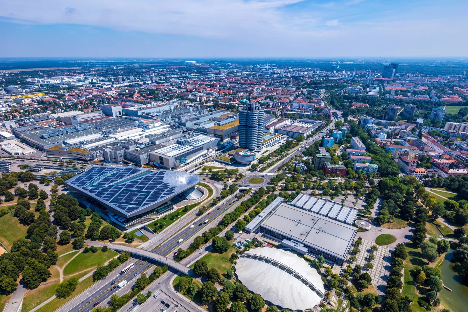 Aerial view showing the BMW headquarters building and surrounding area in Munich.