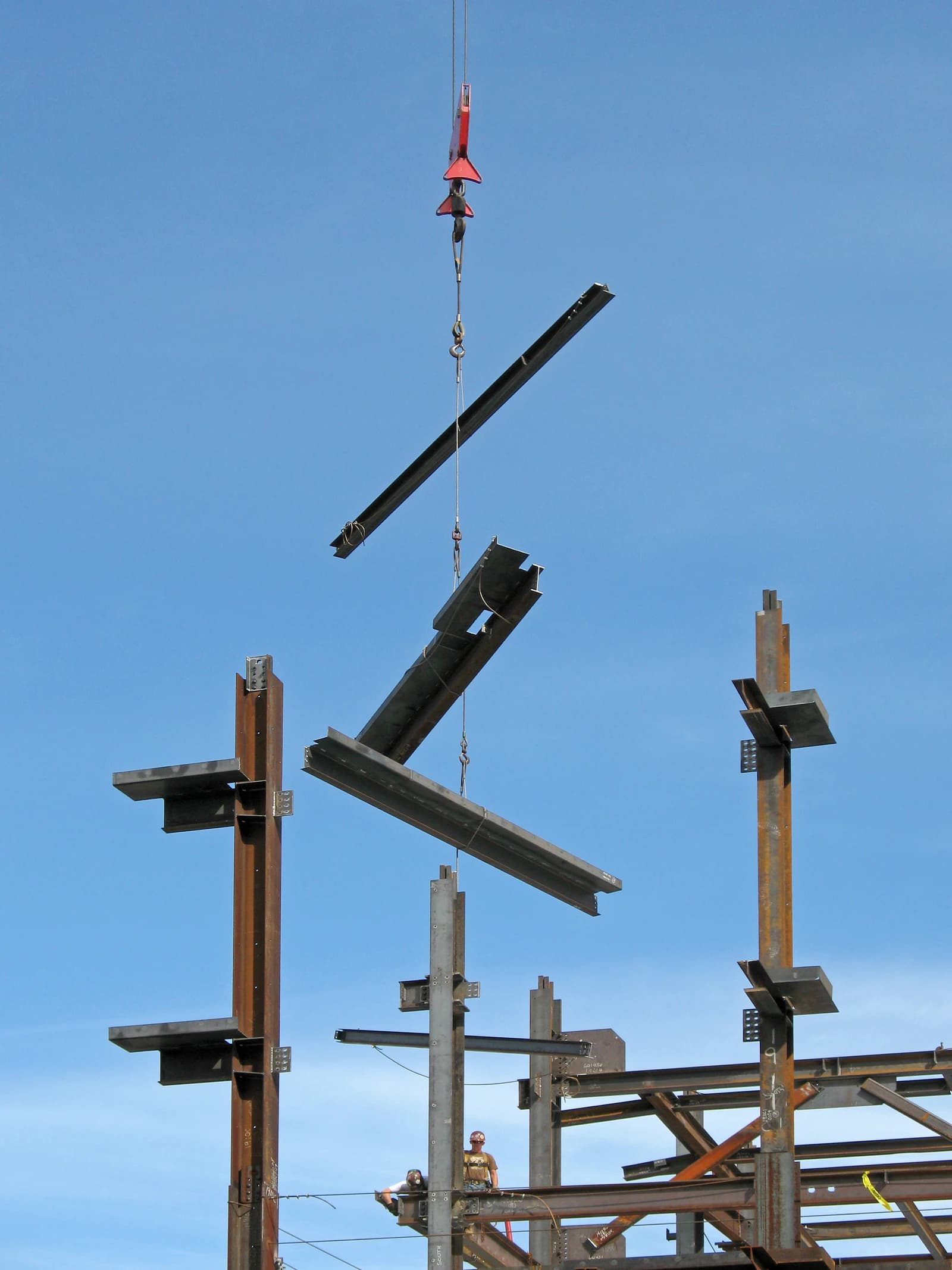 Construction workers installing steel girders at Massachusetts General Hospital.