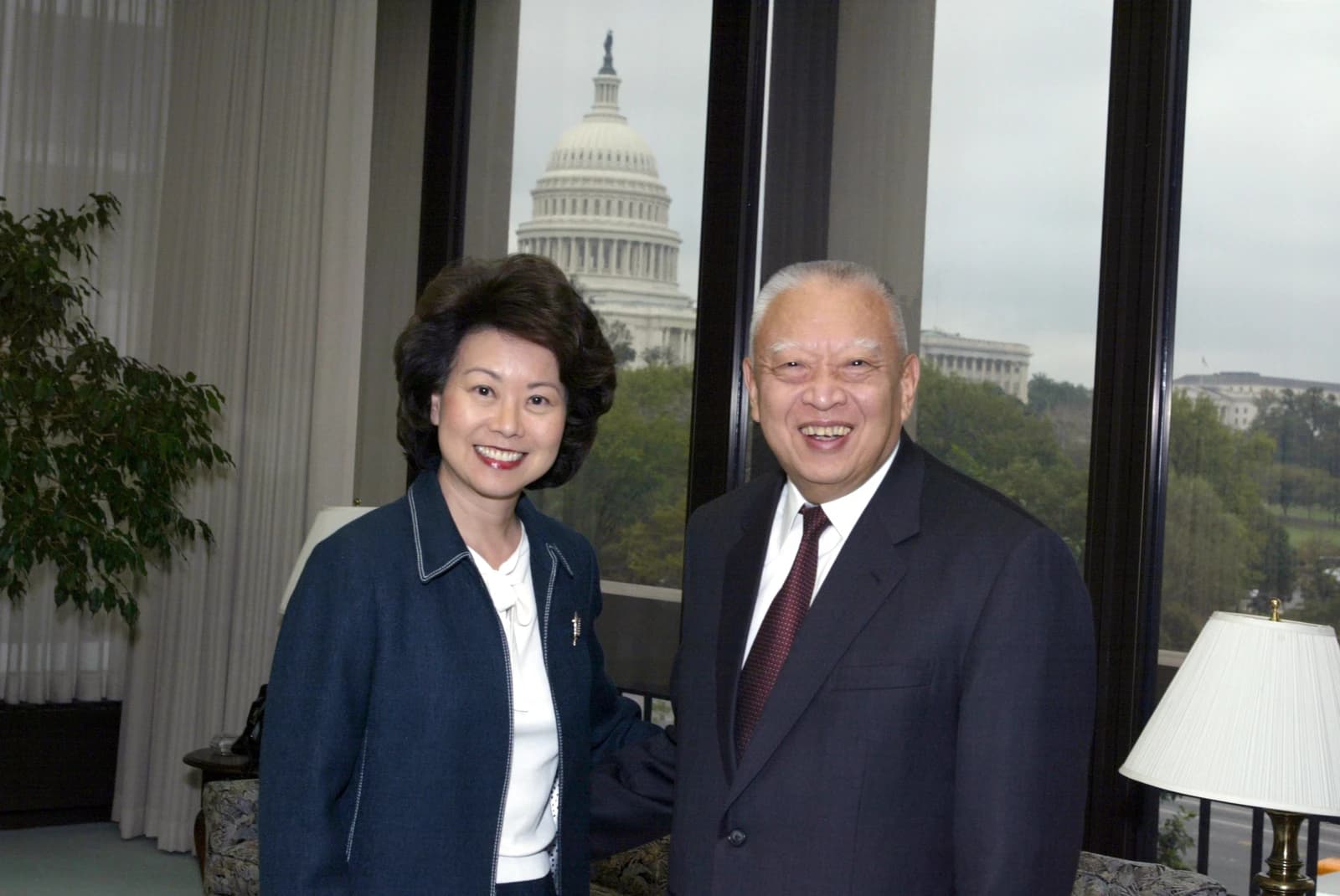 Elaine Chao and Tung Chee-hwa, former Chief Executive of Hong Kong, smiling for a photo.