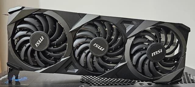 An MSI GeForce RTX 3070 VENTUS 3X OC graphics card with three fans.