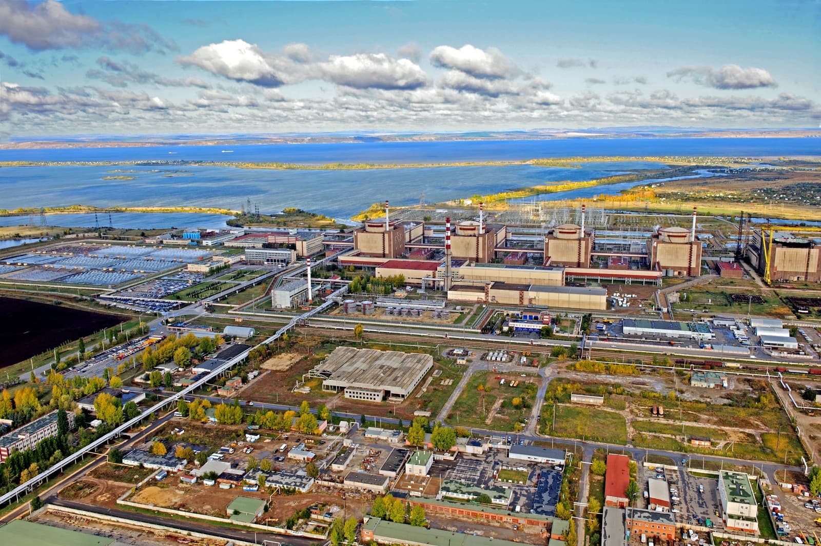 Aerial view shows the Balakovo Nuclear Power Plant with multiple reactor buildings and cooling infrastructure.