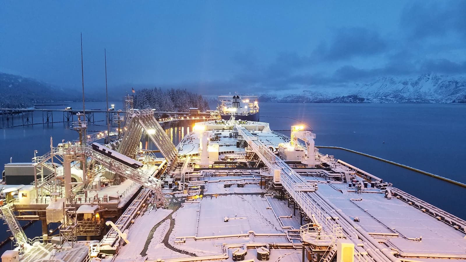 Oil tanker MT Alaskan Navigator at Valdez Marine Terminal in snowy conditions.