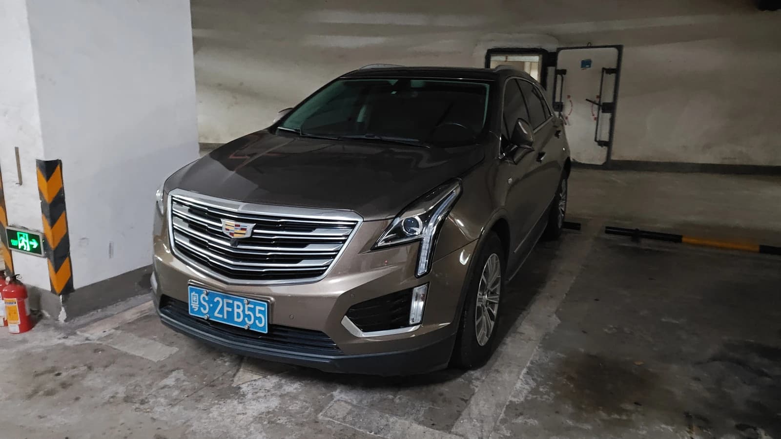 Cadillac XT5 vehicle parked in an underground garage.