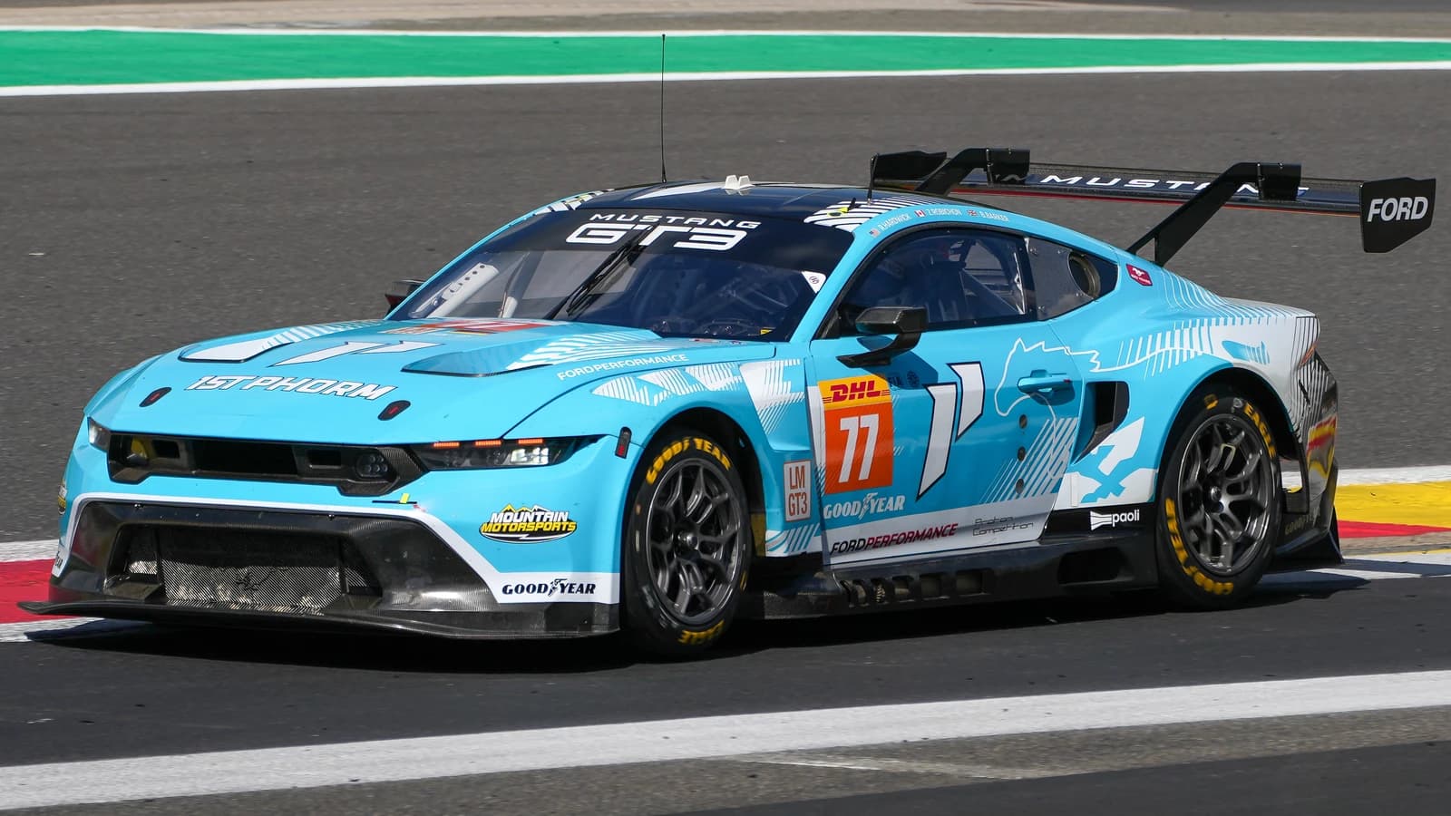Proton Competition Ford Mustang GT3 race car, number 77, on a track.