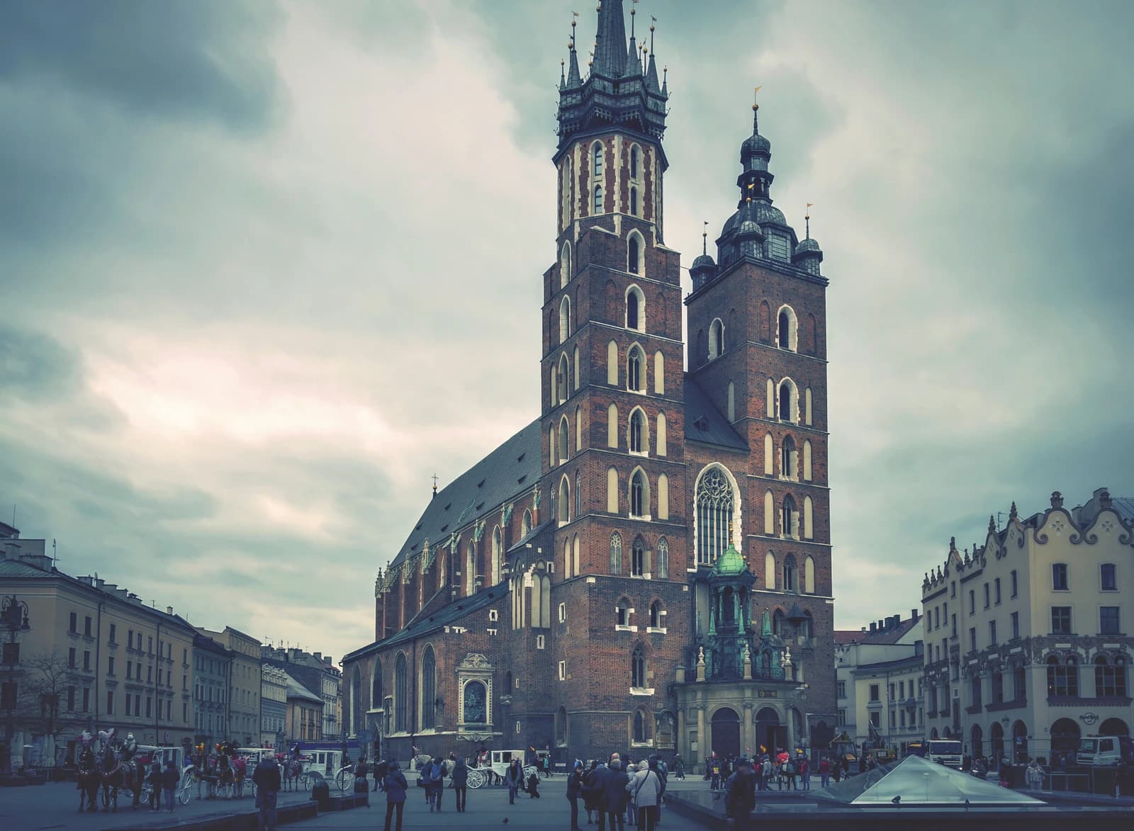 St. Mary's Basilica, a large brick church with two towers, in Krakow, Poland.