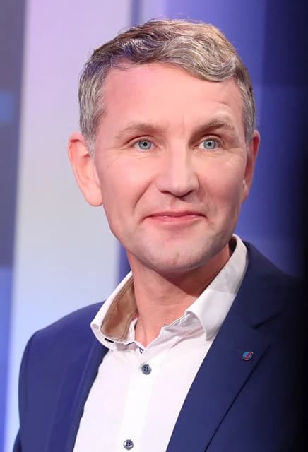 Björn Höcke, politician for AfD, at a political event indoors.