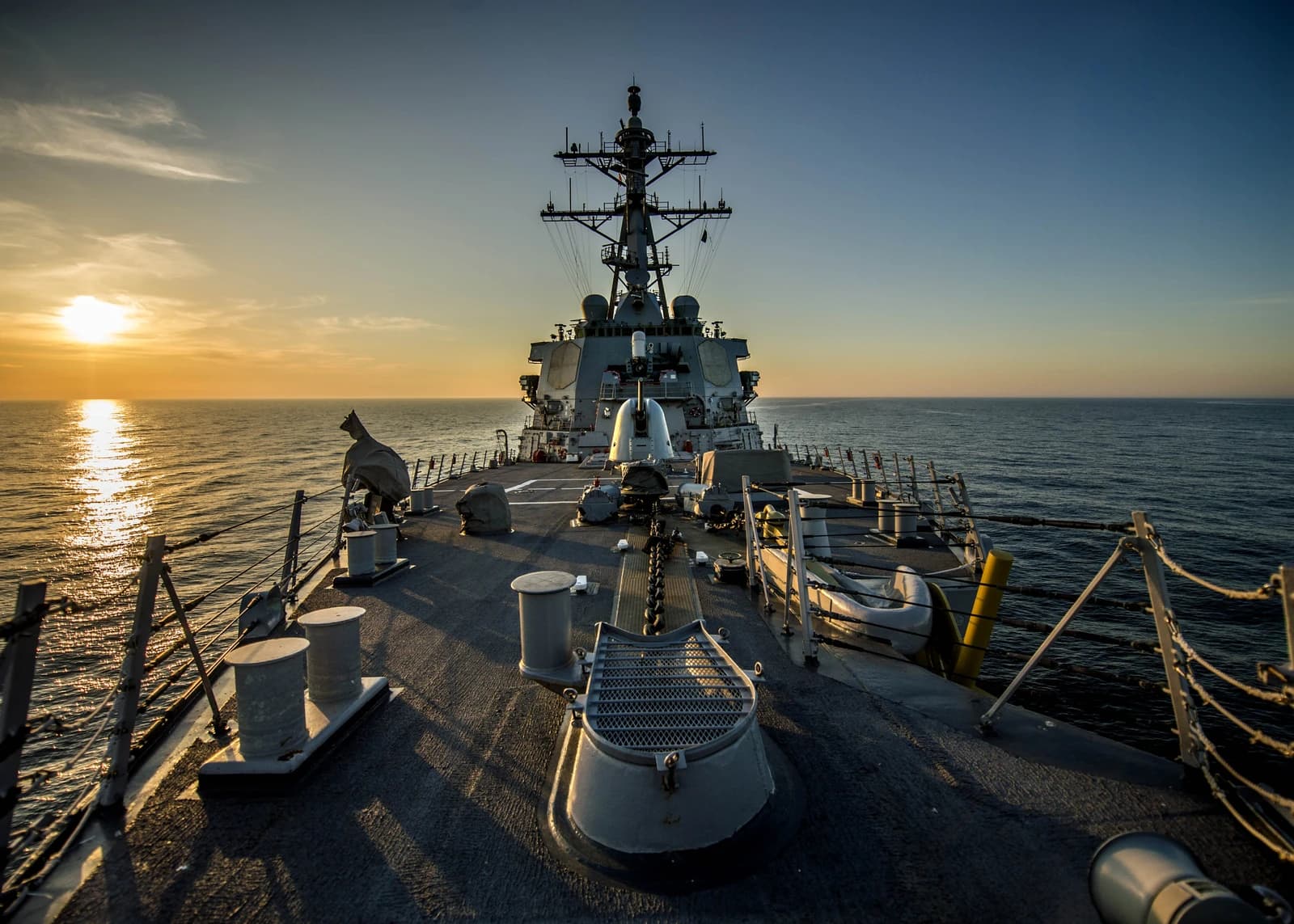 The USS Donald Cook destroyer sailing through the Black Sea at sunset.