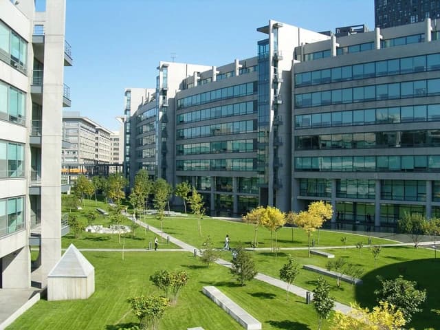 Modern buildings of Lenovo's R&D campus in Beijing with landscaped green space.