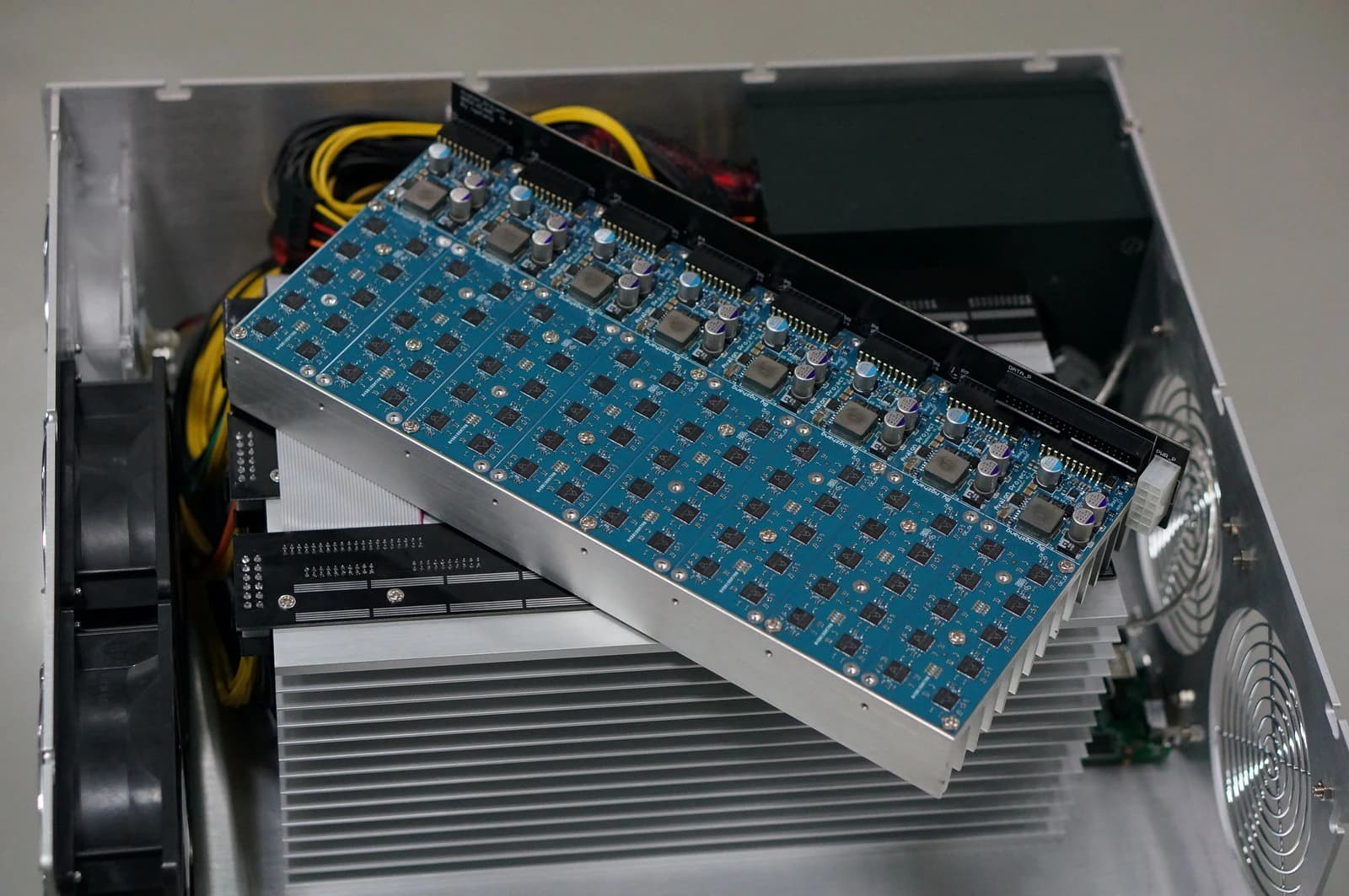 Close-up view of the internal components of an Avalon ASIC base bitcoin mining machine.