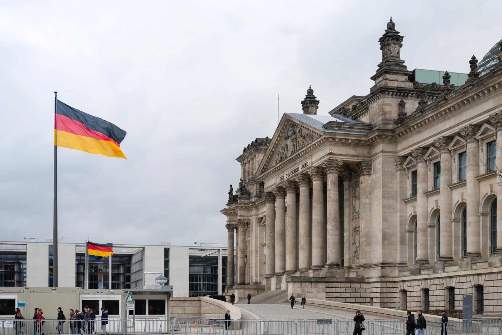 German Bundestag building in Berlin, Germany with a German flag flying.