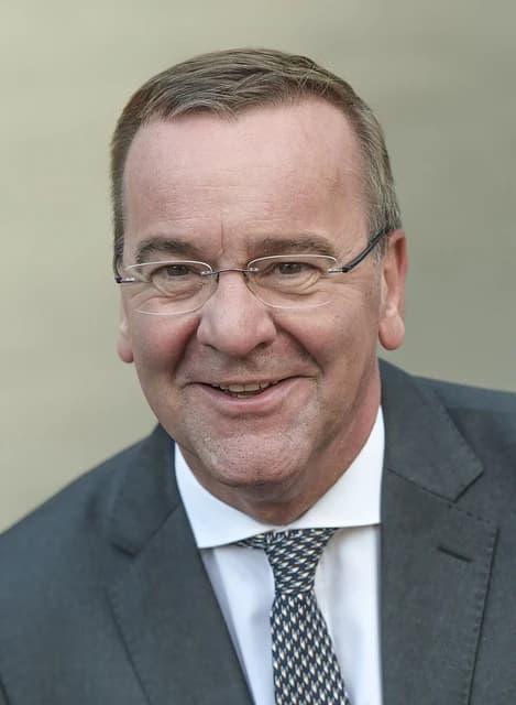 Boris Pistorius, German Defense Minister, smiling in a portrait photo.