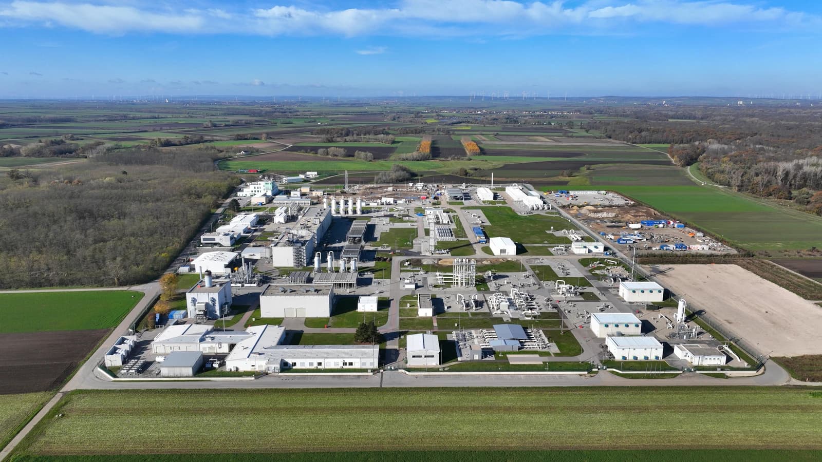 Aerial view of Baumgarten an der March natural gas station, showing industrial buildings and piping.