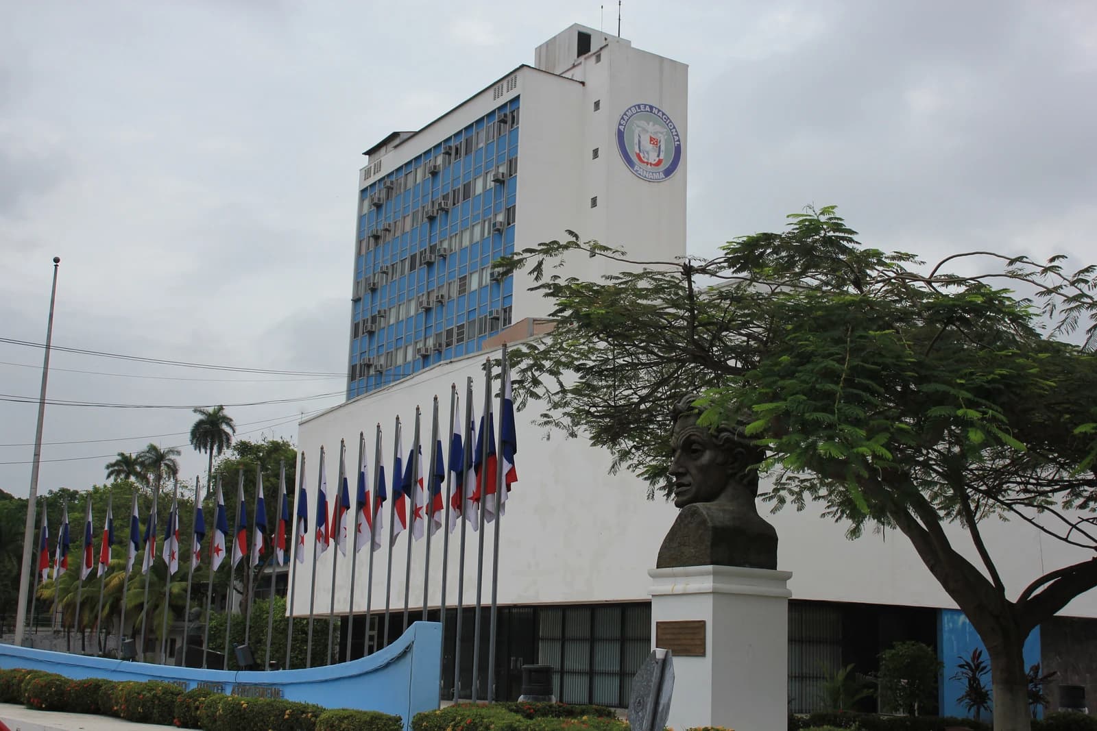 Exterior view of the National Assembly of Panama building with a logo on its facade.