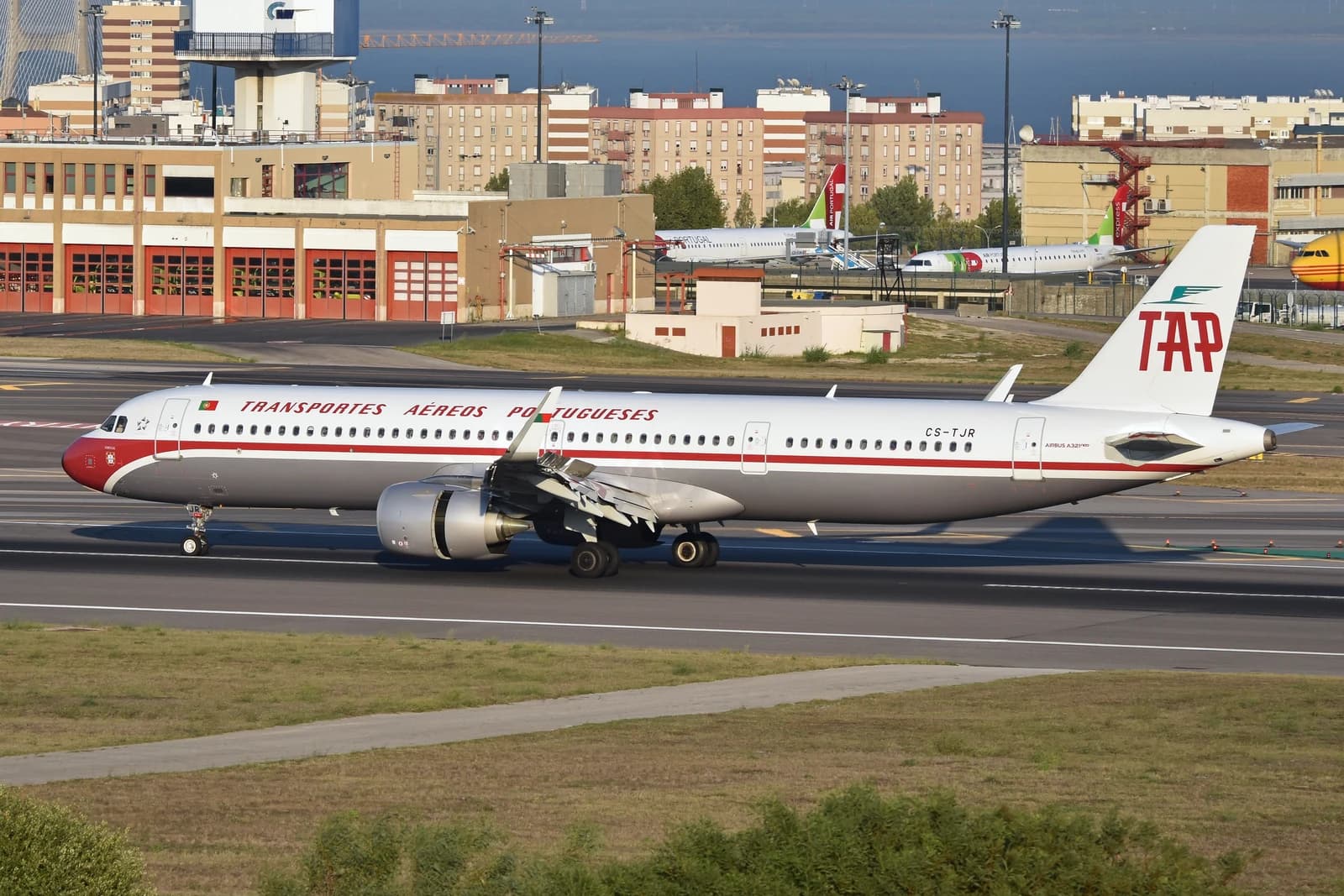 TAP Air Portugal Airbus A321neo aircraft in retro livery on an airport runway.