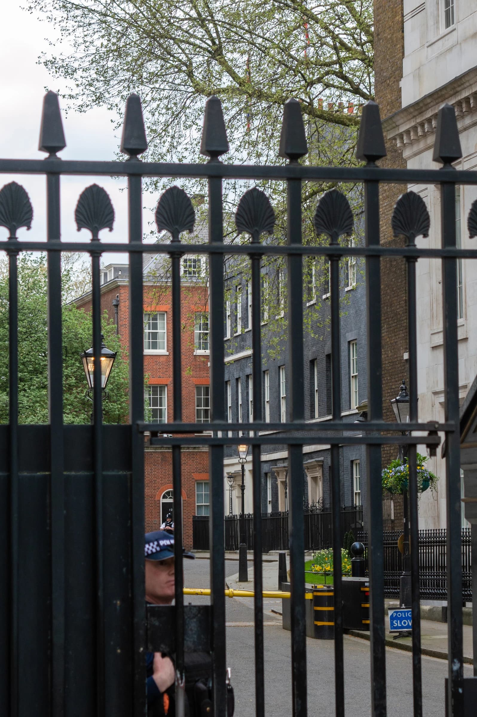 Downing Street buildings visible through the black wrought-iron gates in London.