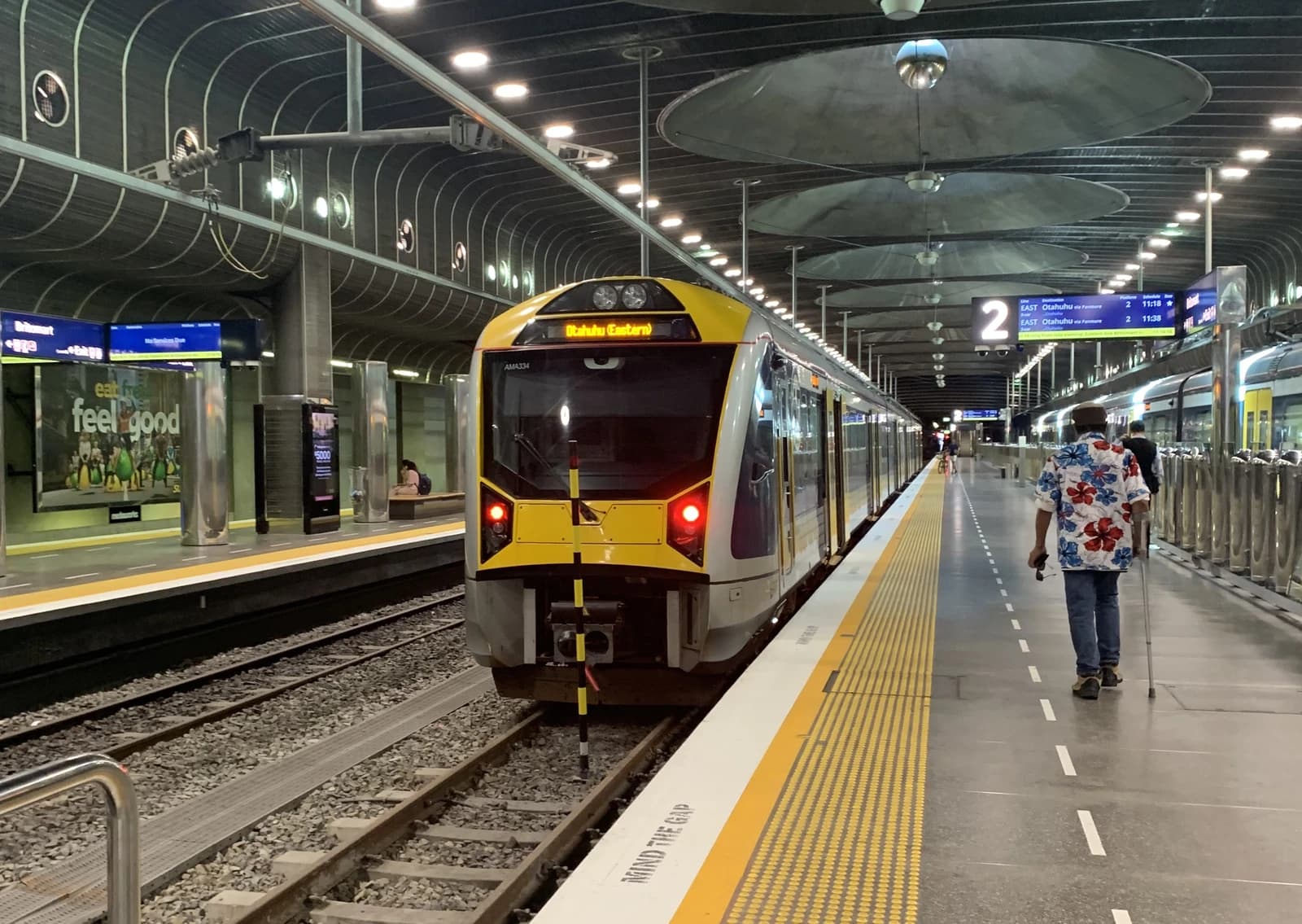 An AM Class train sits at the platform of Britomart Station in Auckland.