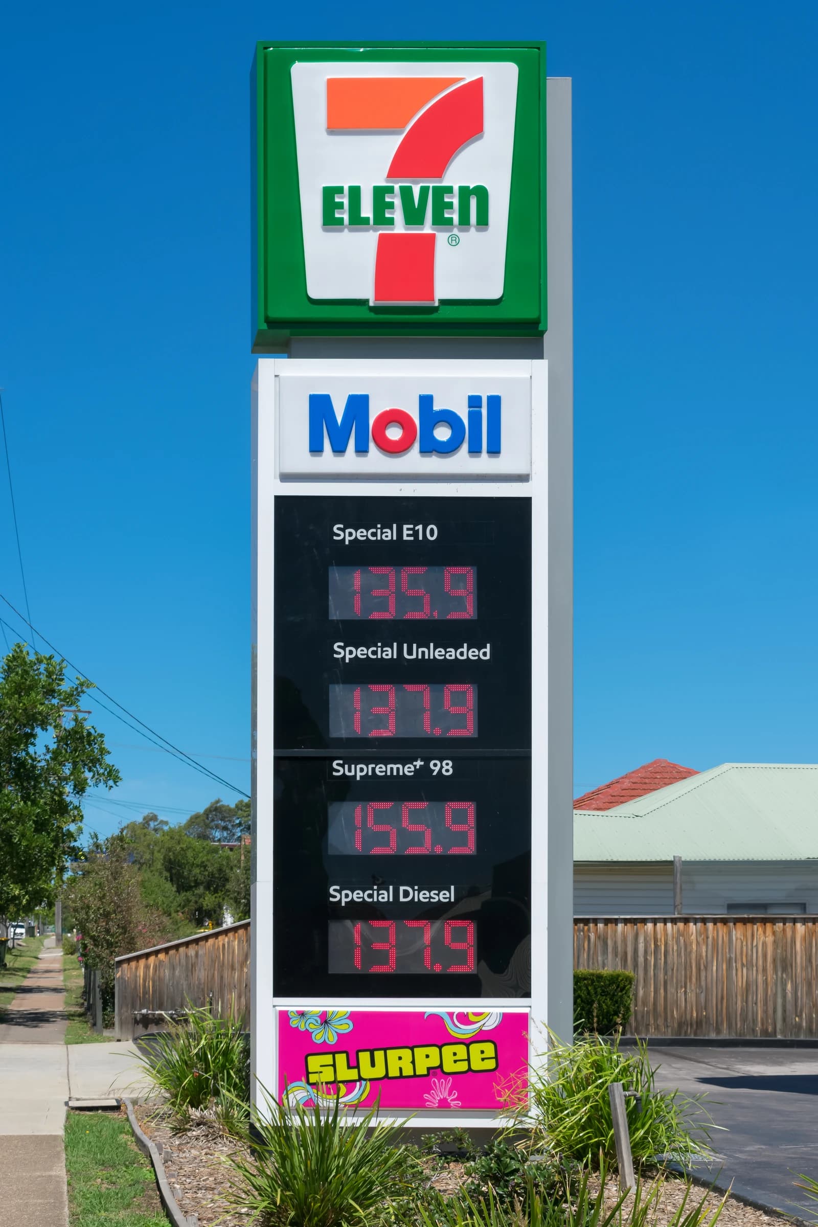 Gas price sign at 7-Eleven Mobil service station, displaying current fuel prices.