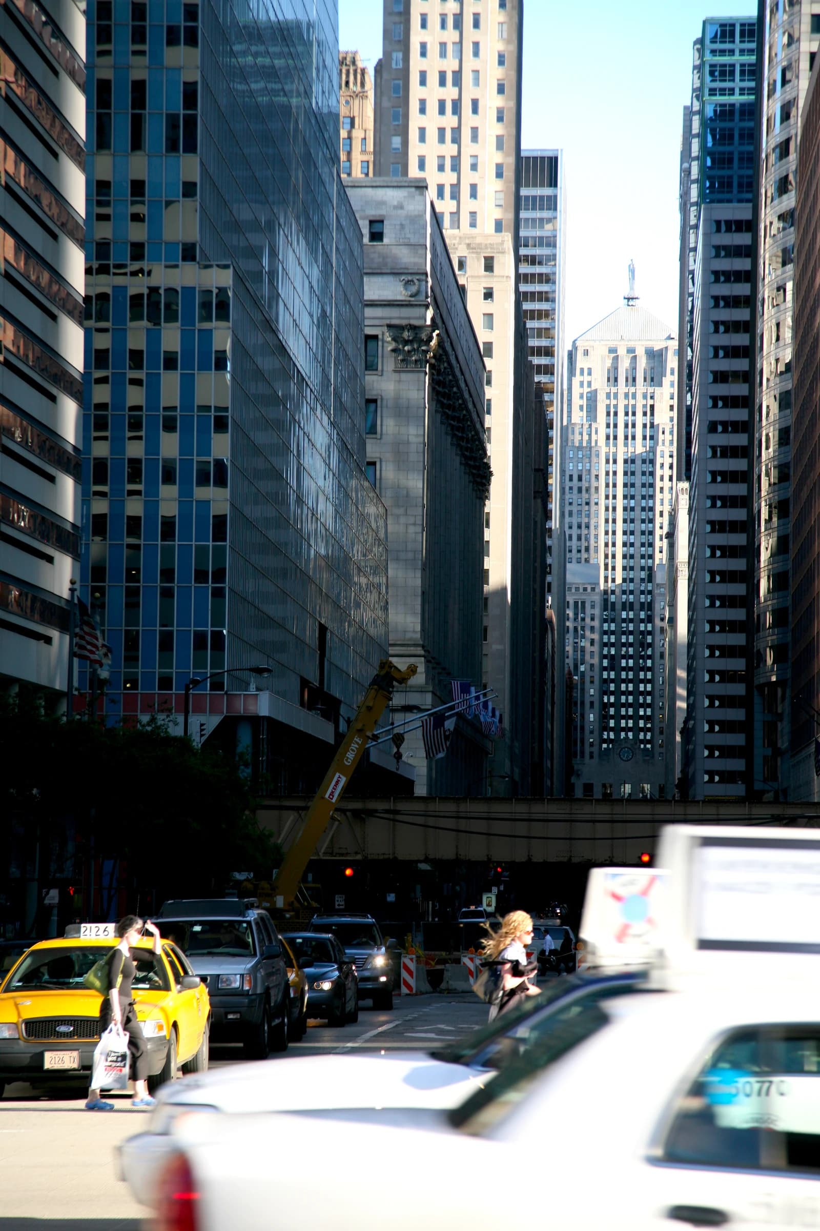 The Chicago Board of Trade Building stands prominently amidst other skyscrapers on North LaSalle Street.