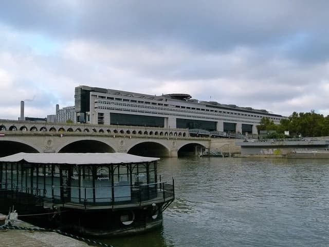 The Ministry of Economy and Finance building in Bercy, Paris, viewed from across the Seine River.