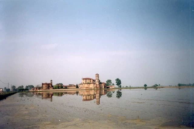 Abbey of Lucedio reflected in flooded rice fields in the Vercelli province.