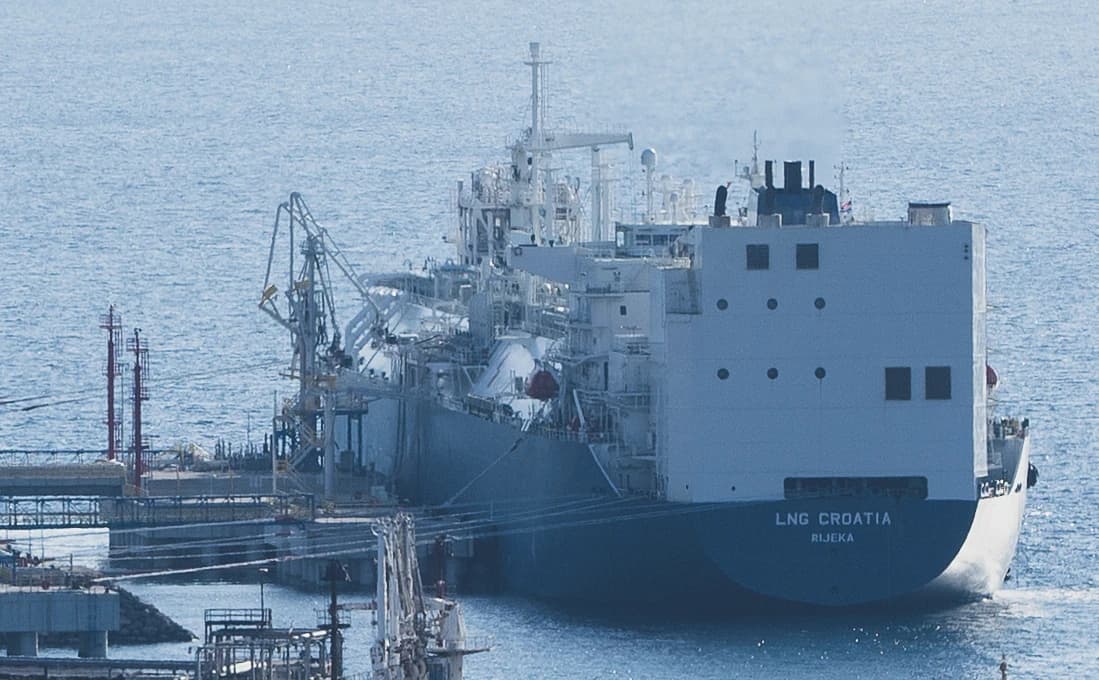 LNG Croatia ship docked at an LNG terminal with cargo loading arms.