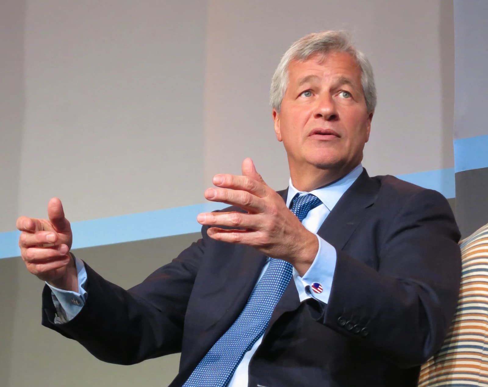 Jamie Dimon, CEO of JPMorgan Chase, gesturing with his hands while speaking.