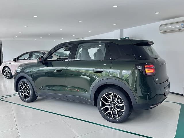 Green Leapmotor A10 electric SUV parked inside a car showroom.
