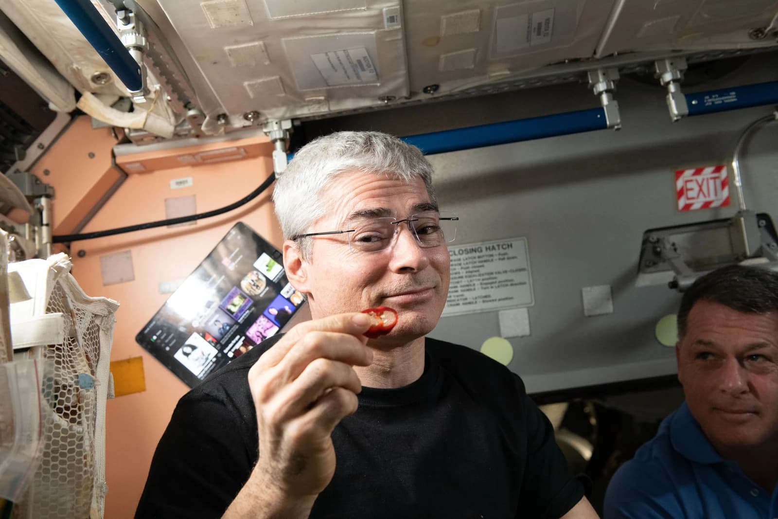 Astronaut Mark Vande Hei samples a chile pepper on the International Space Station.