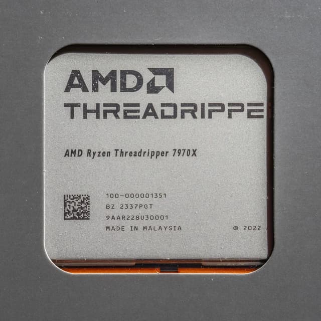 AMD Ryzen Threadripper 7970X processor showing product details.